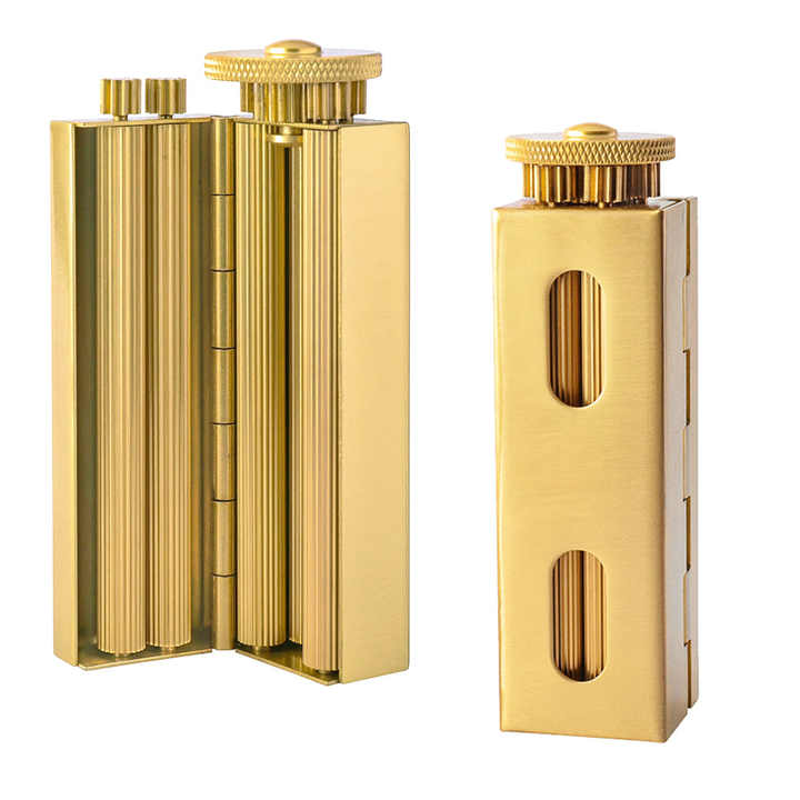Gold-tone metal herbal rolling machine opened to show the rolling mechanism